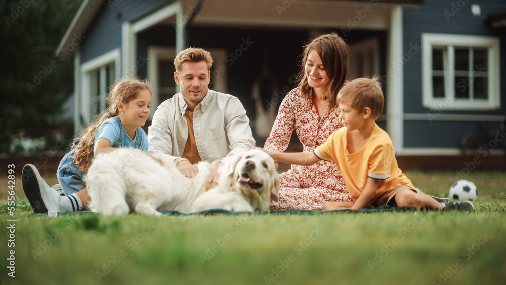 Portrait of a Happy Young Family Couple with a Son and Daughter, and a Noble White Golden Retriever 