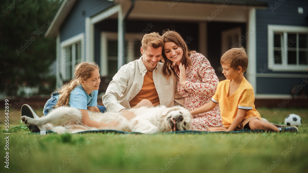 Portrait of a Happy Young Family Couple with a Son and Daughter, and a Noble White Golden Retriever 