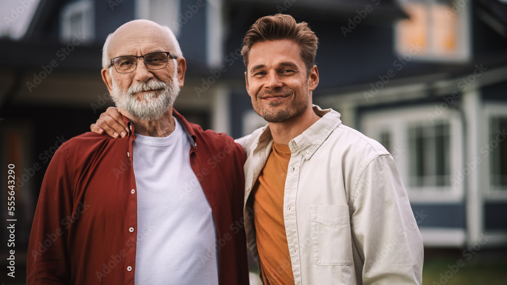 Portrait of a Happy Senior Father or Grandparent Posing Together with His Handsome Adult Son. Family