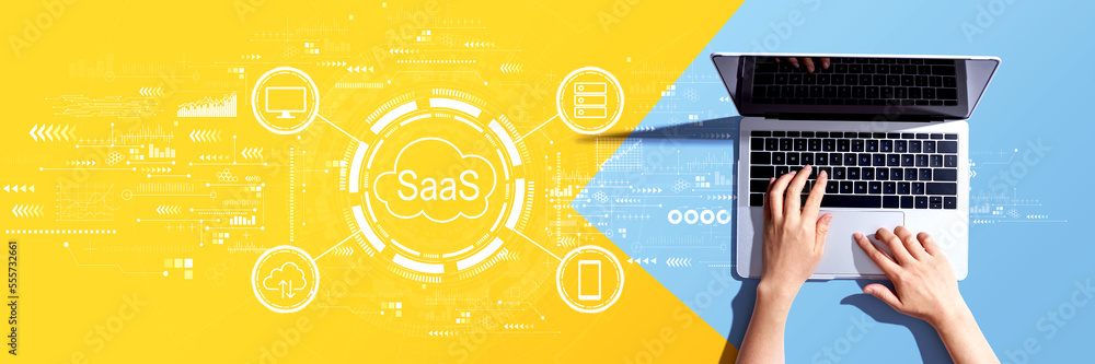 SaaS - software as a service concept with person using a laptop computer