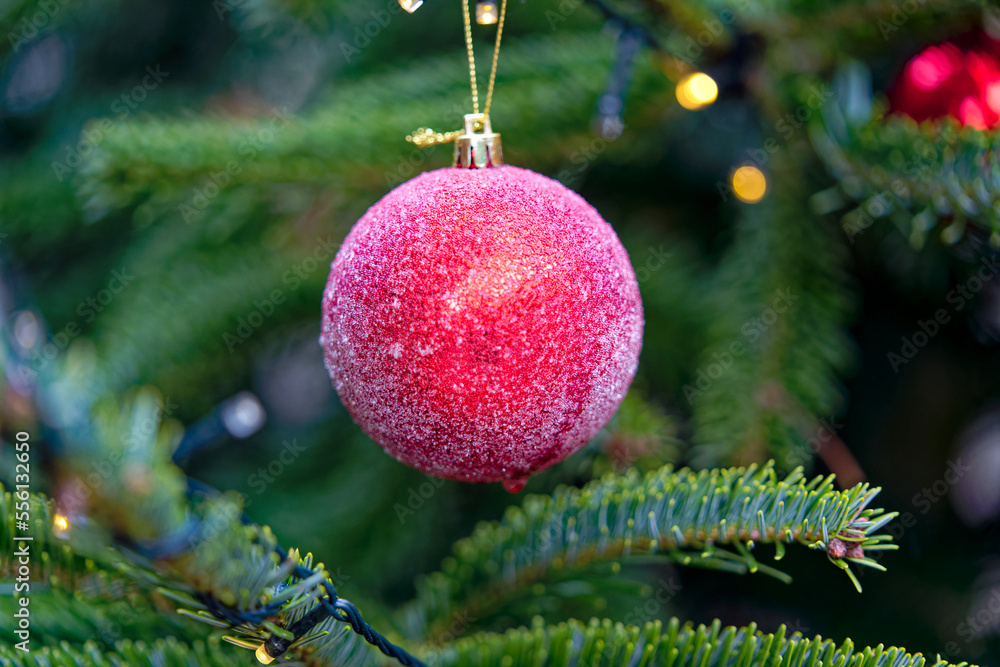 Christmas tree with Christmas lights with bokeh and red Christmas bauble decoration at City of Züric