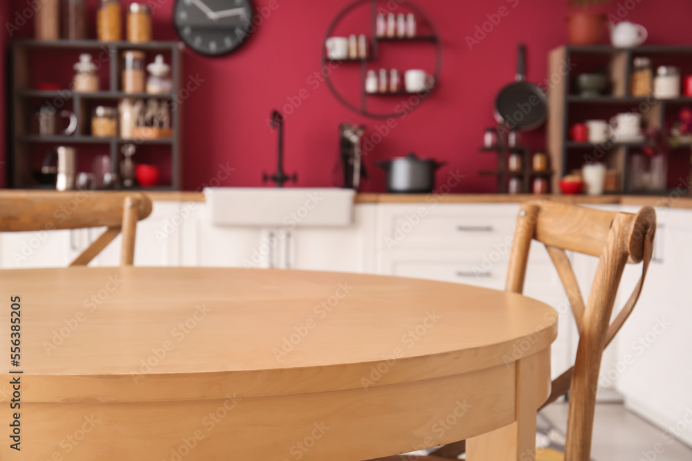 Wooden dining table and chairs in modern kitchen