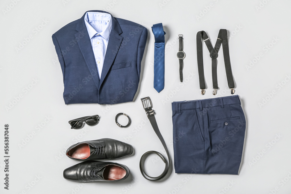 Elegant male clothes and accessories on light background