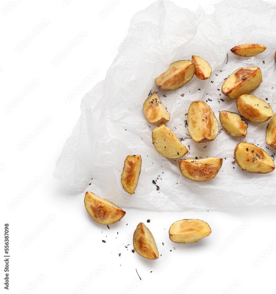 Baking paper with tasty baked potato on white background