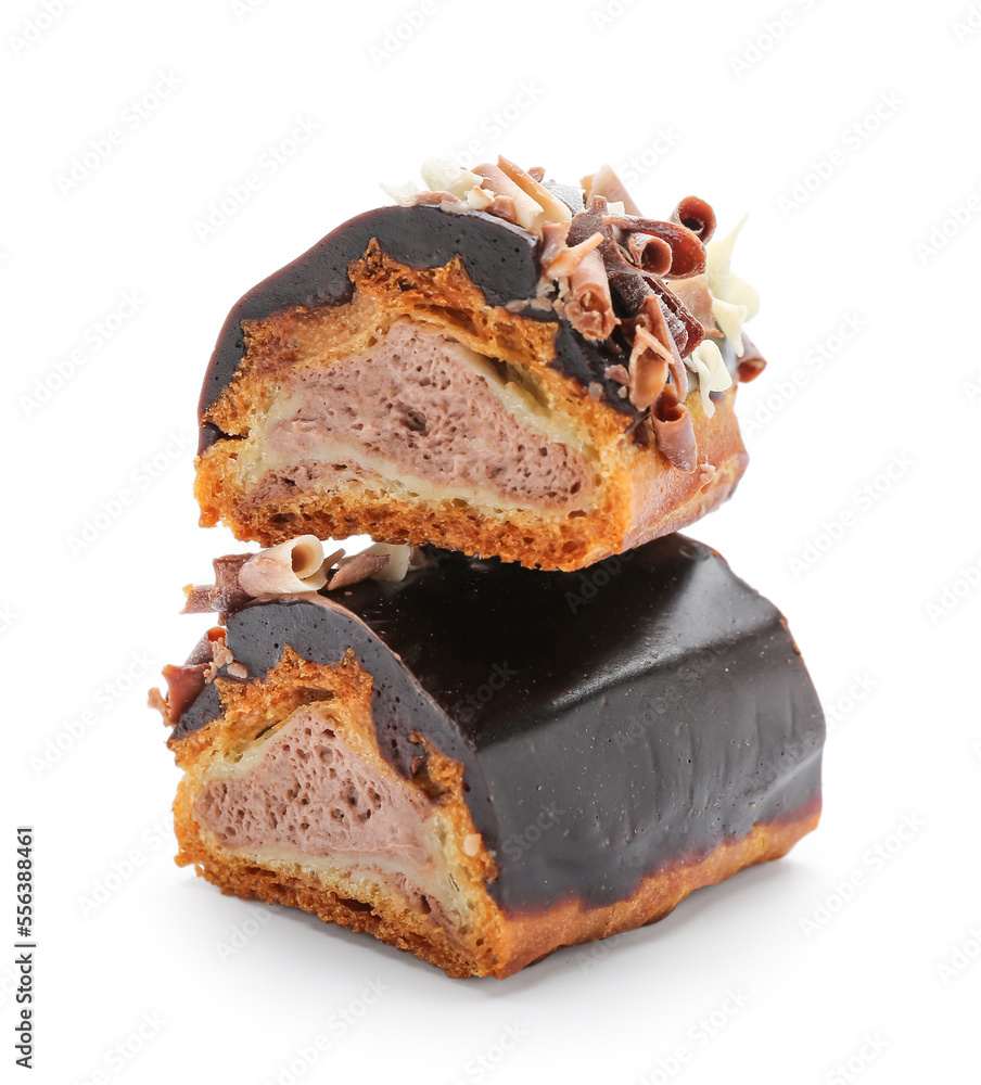 Pieces of sweet chocolate eclair on white background