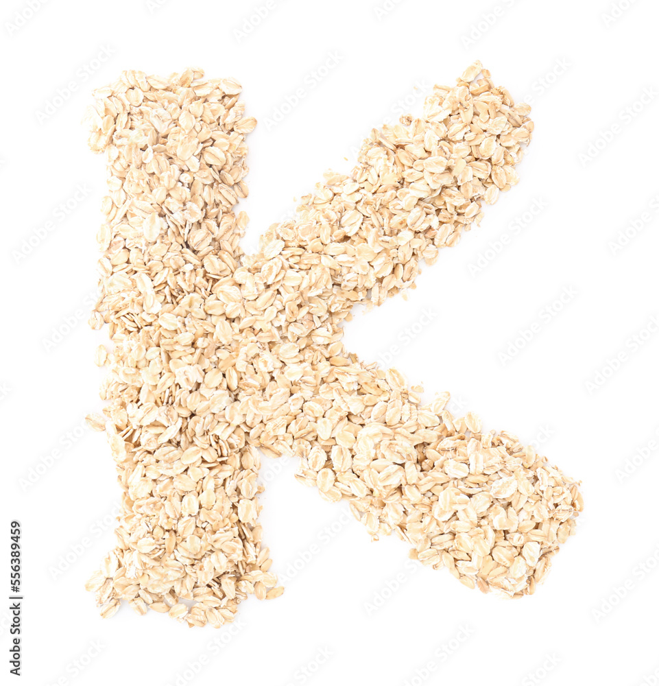 Letter K made of raw oatmeal on white background