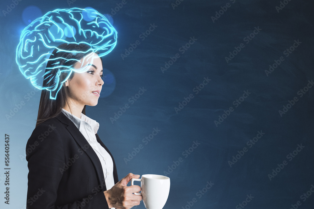 businesswoman with coffee cup and glowing digital brain hologram standing on blurry chalkboard wall 