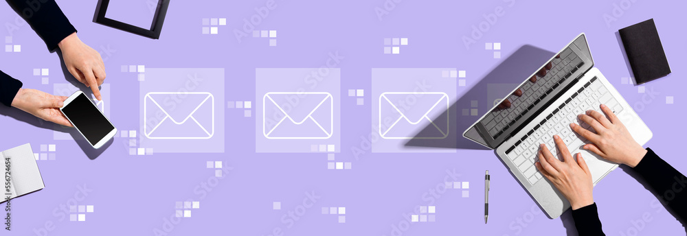 Email concept with two people working together