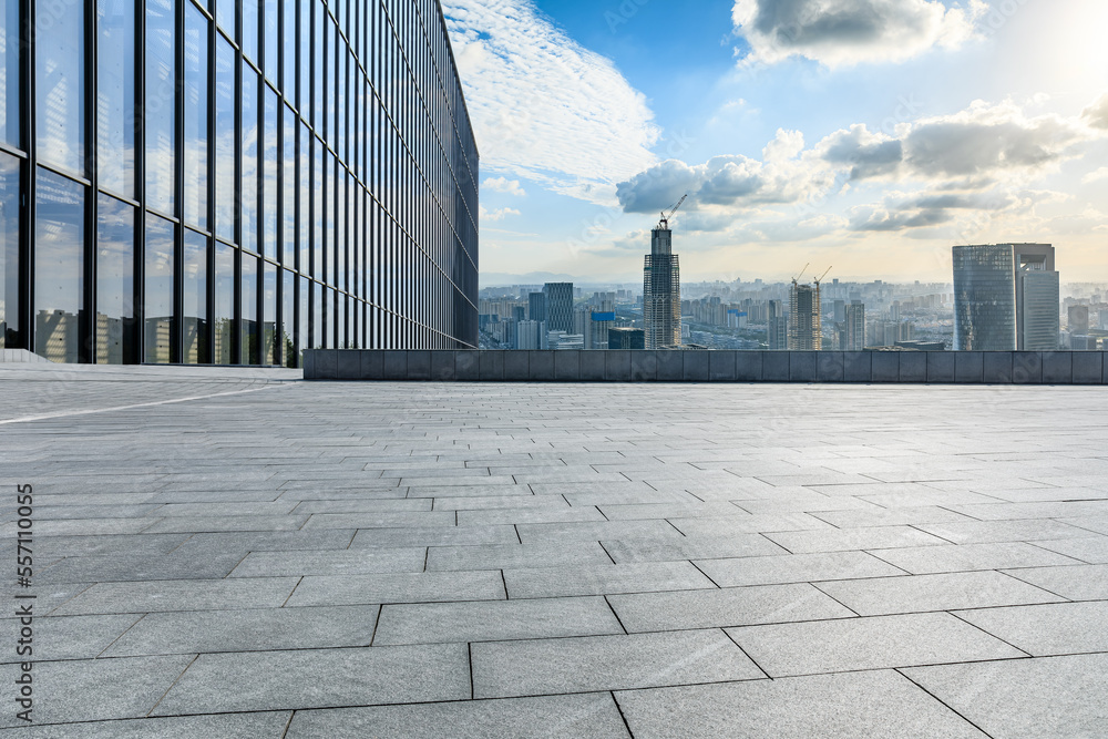 Empty square floor and modern city skyline with buildings at sunset in Ningbo, Zhejiang Province, Ch