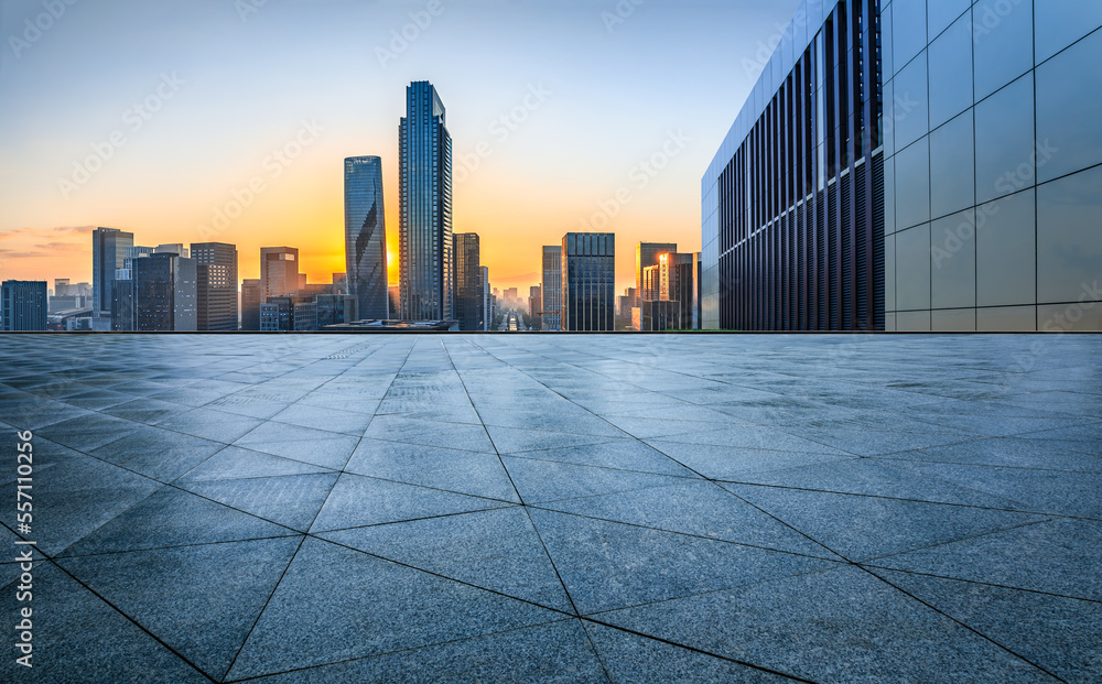 Empty square floor and modern city skyline with buildings at sunset in Ningbo, Zhejiang Province, Ch