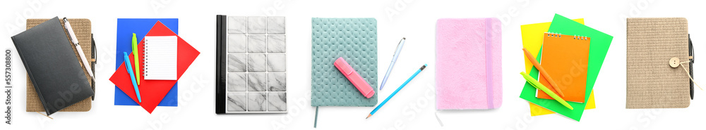 Collection of stylish notebooks with stationery on white background