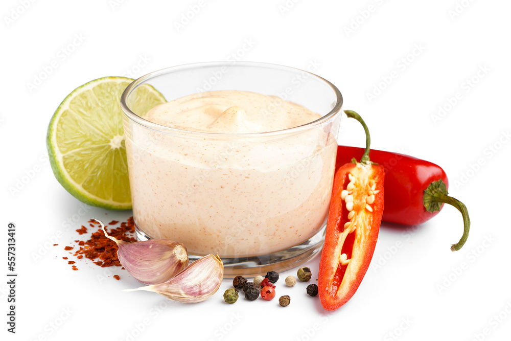 Bowl of tasty chipotle sauce and spices on white background