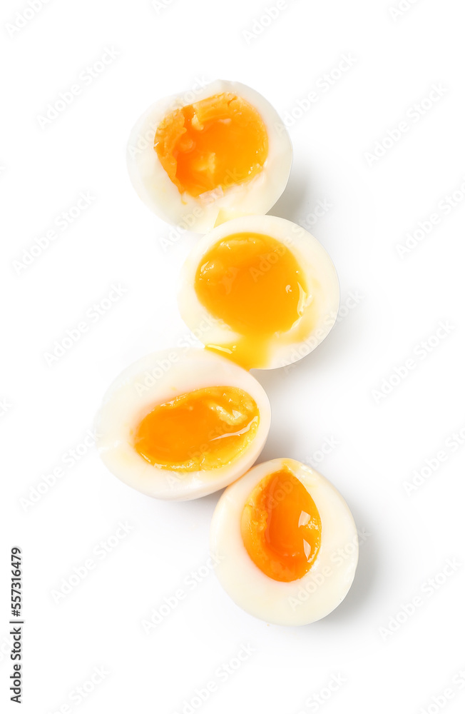 Sliced soft boiled eggs on white background