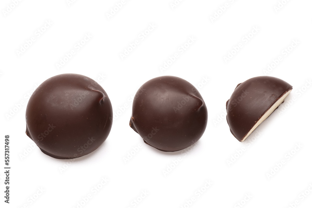 Chocolate birds milk candies on white background