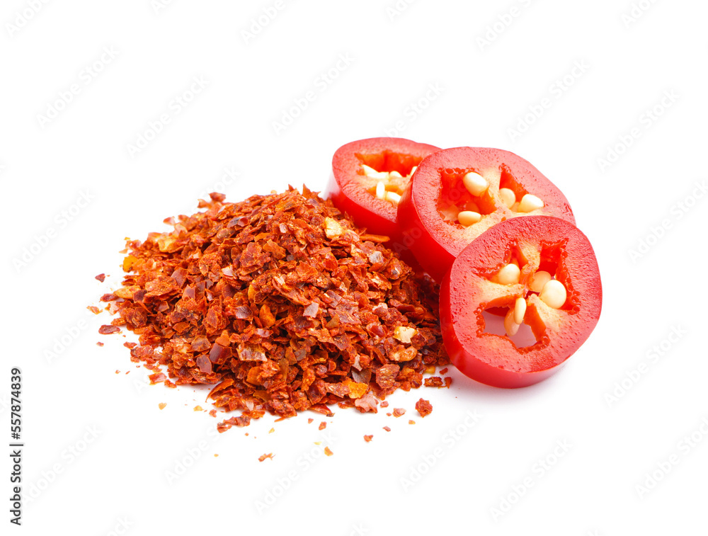 Slices of fresh jalapeno pepper and chipotle chili flakes on white background