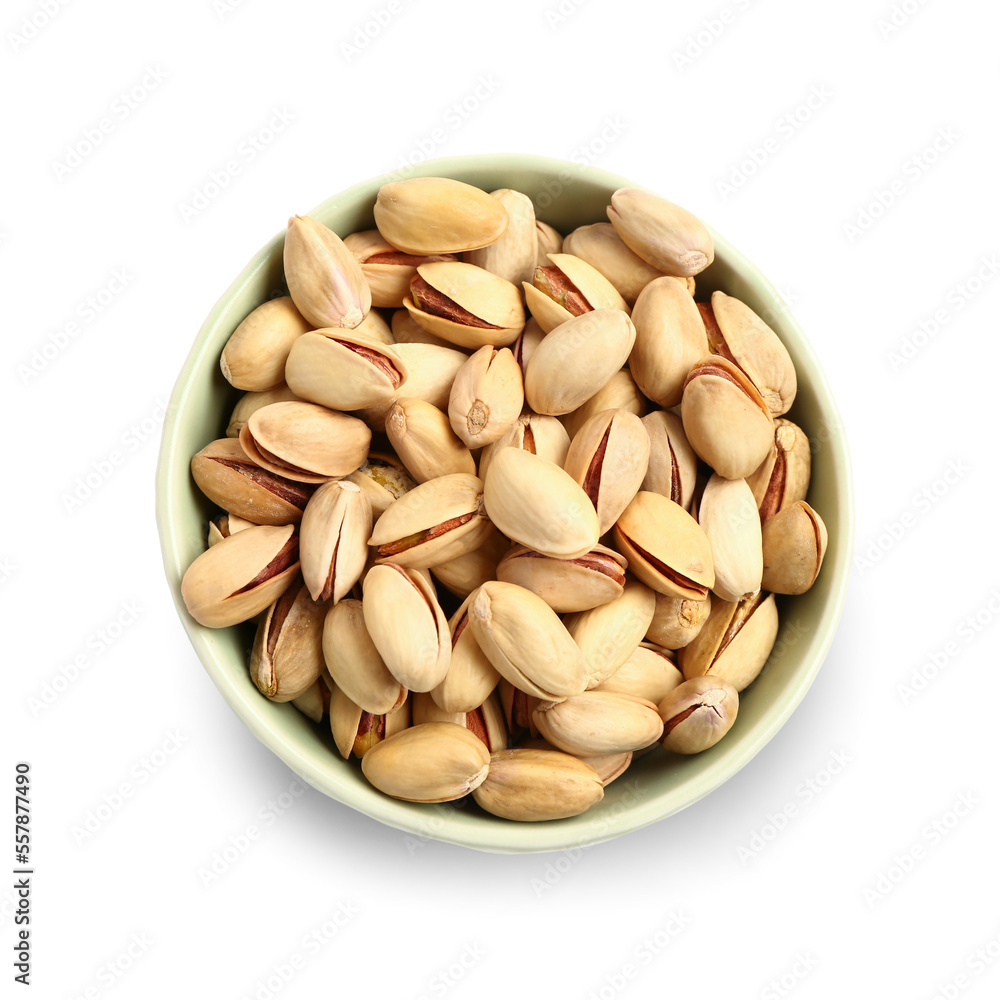 Bowl with tasty pistachio nuts isolated on white background