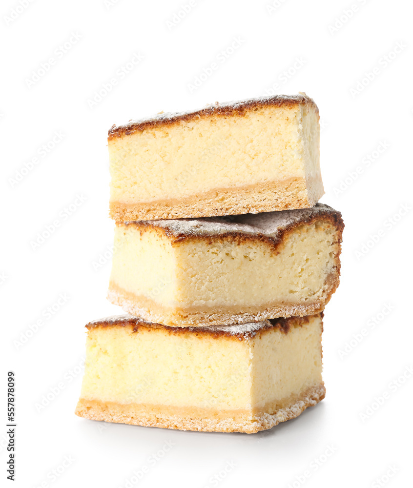 Pieces of delicious cheese pie with sugar powder on white background