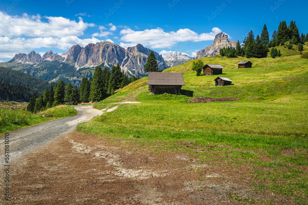 Wooden huts on the hills in Val Badia valley, Dolomites