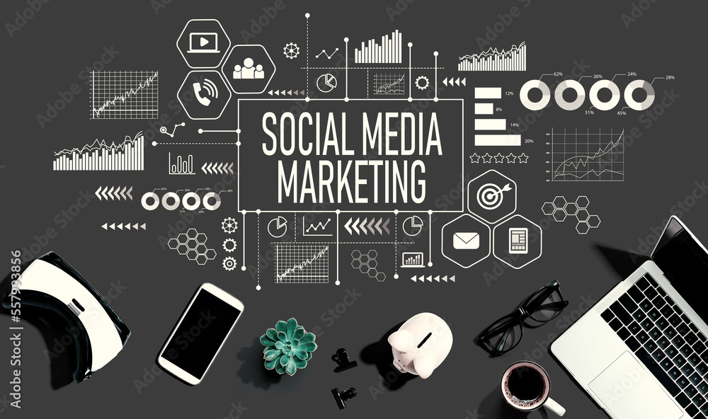 Social media marketing theme with electronic gadgets and office supplies - flat lay