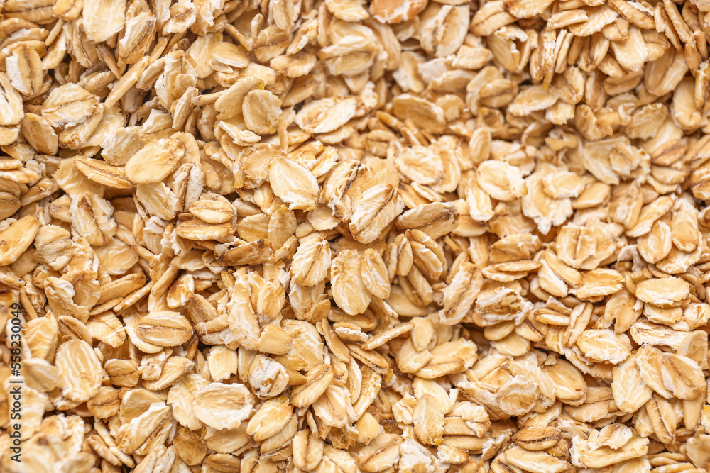 Raw oat flakes as background, closeup