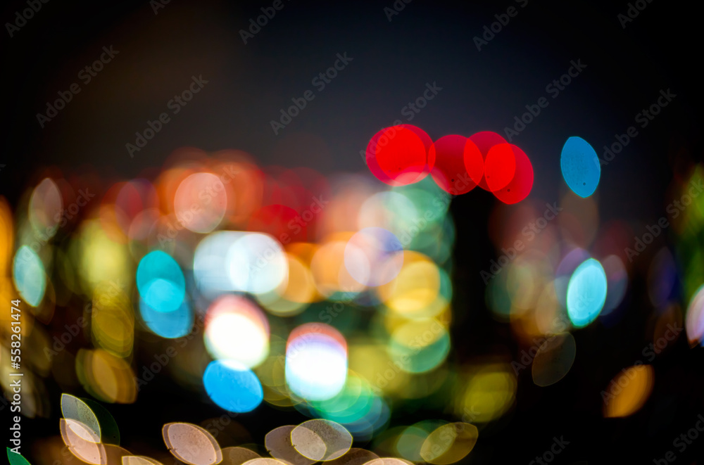 Abstract blurred bokeh neon light trails city night background