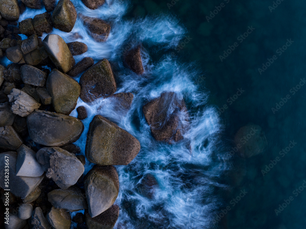 Amazing top view beautiful seashore, Aerial view crashing waves on rocks, Beautiful sea in Phuket is