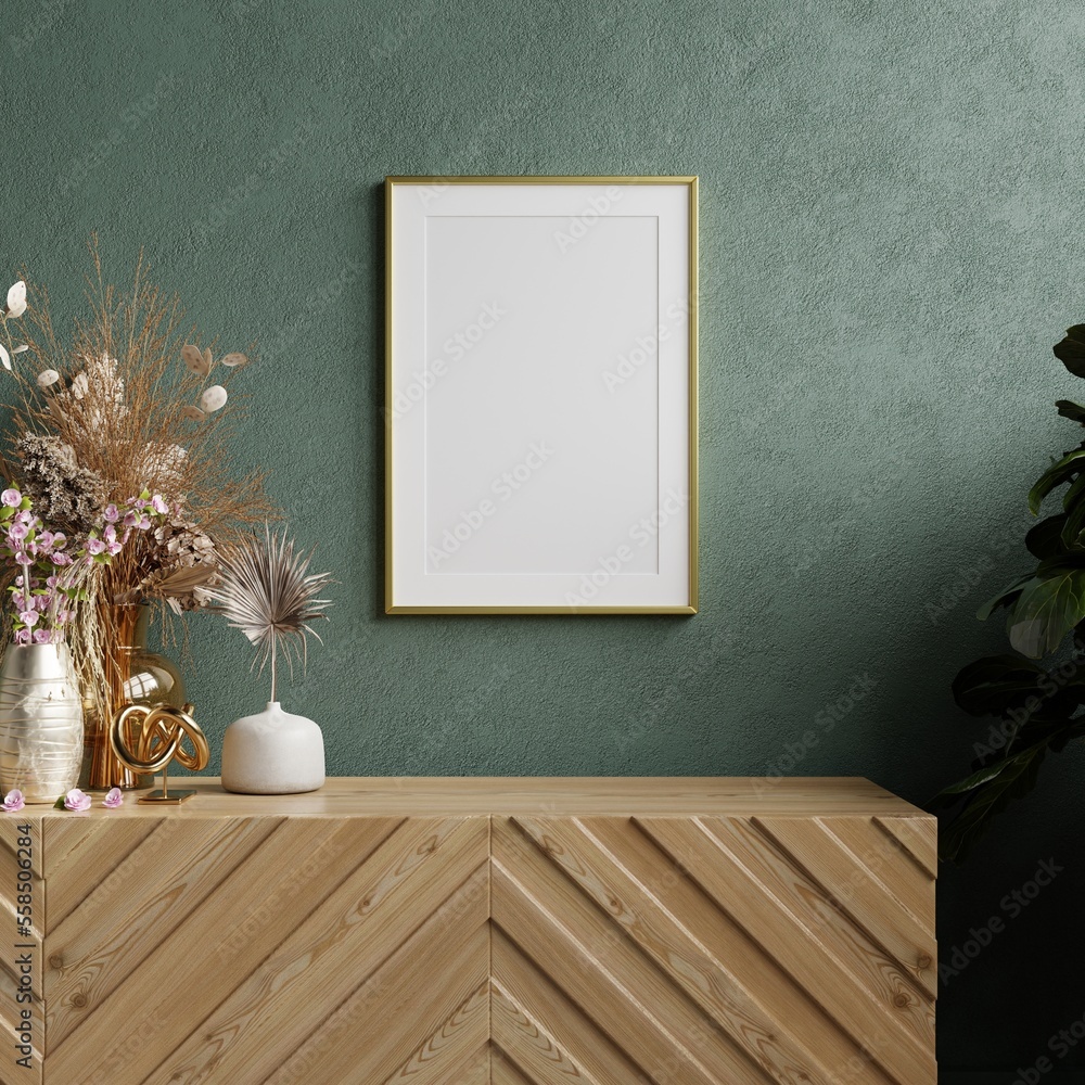 Mockup photo frame dark green wall mounted on the wooden cabinet.