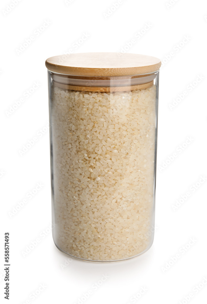 Glass jar of rice on white background