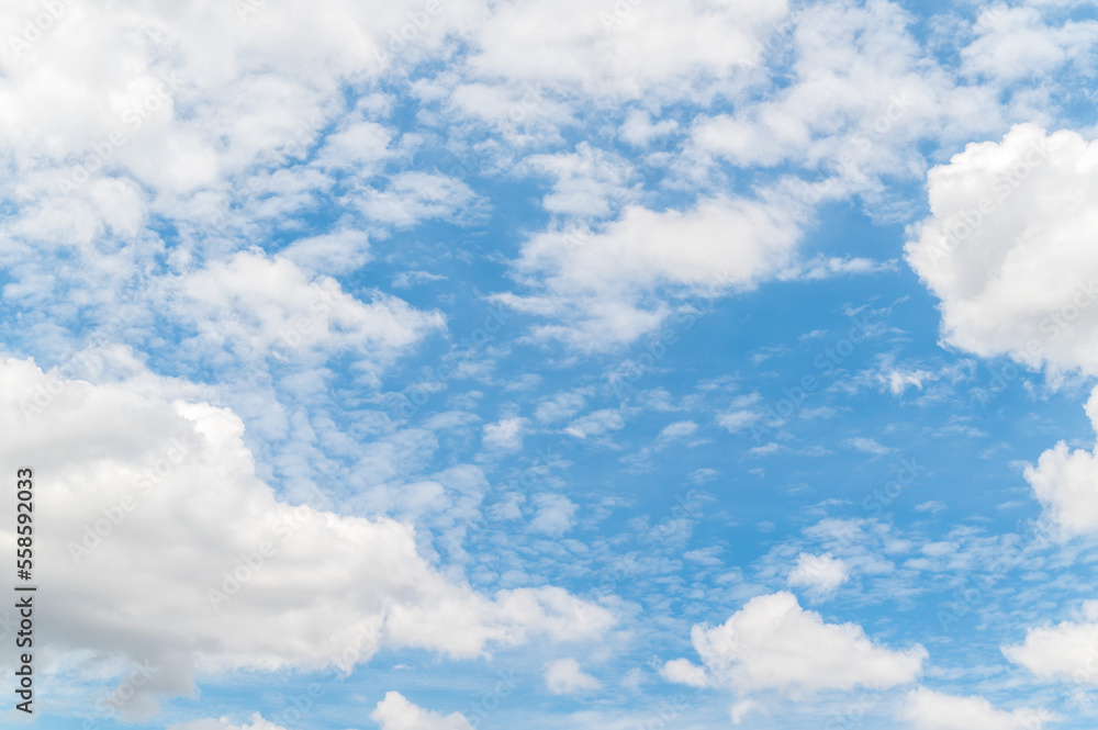 Beautiful white fluffy clouds in blue sky. Nature background from white clouds in sunny day