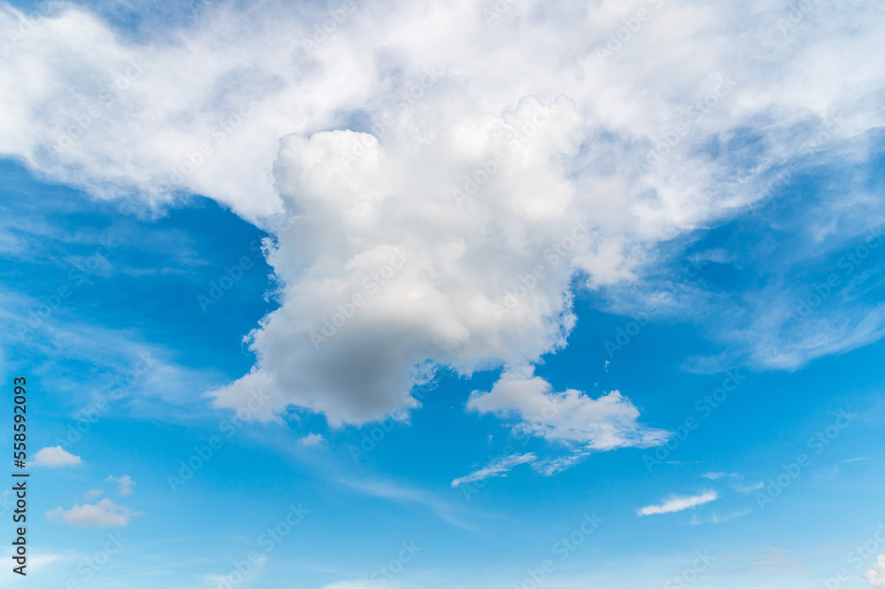 Beautiful white fluffy clouds in blue sky. Nature background from white clouds in sunny day