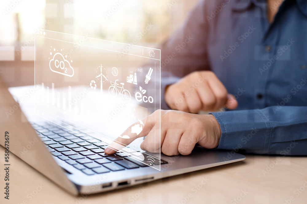 Businessman using laptops and touch recycle symbol with virtual modern reduce CO2 emission concept w