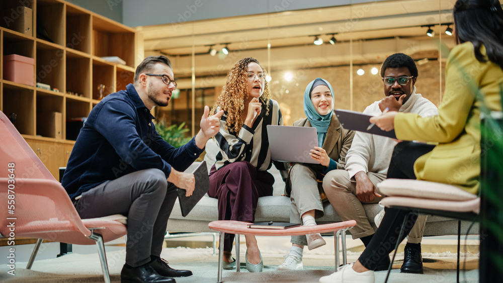 Wide Shot of a Multiethnic Group of People Discussing Ideas in a Meeting Room at Office. Businesspeo