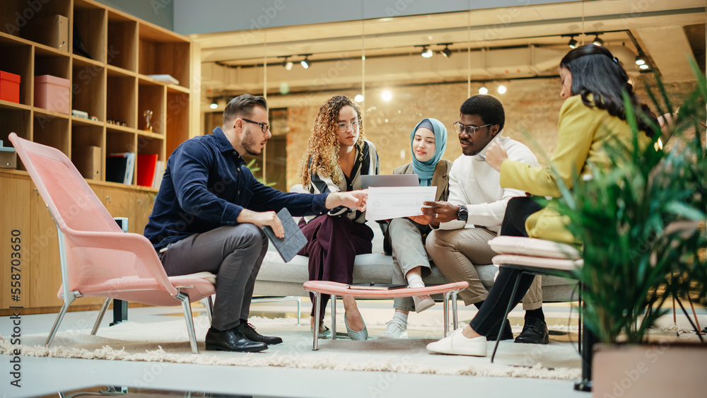 Multiethnic Youthful Group of People Preparing a Presentation in a Casual Conference Room at Office.