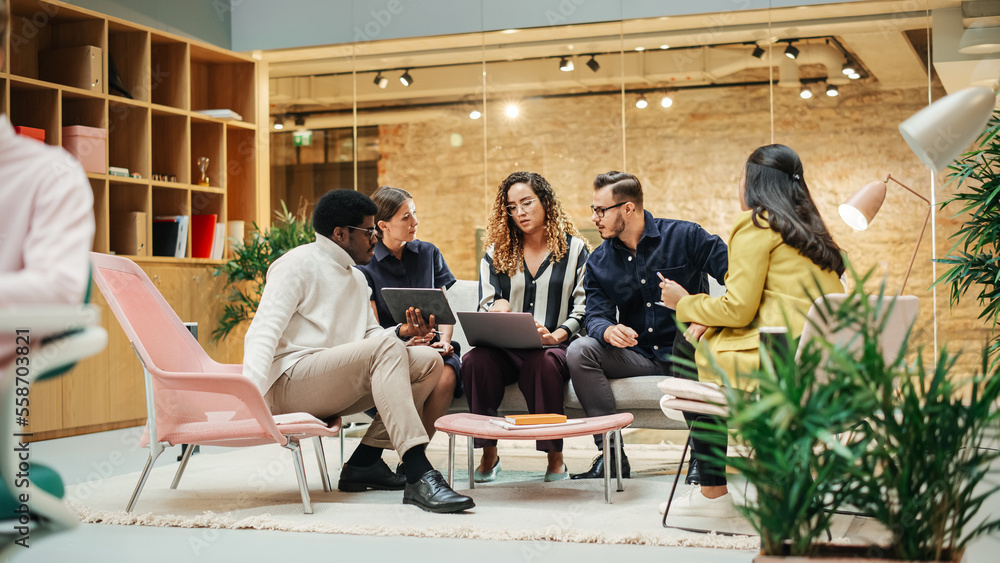 Wide Shot of a Multiethnic Group of People Discussing Ideas in a Meeting Room at Office. Businesspeo