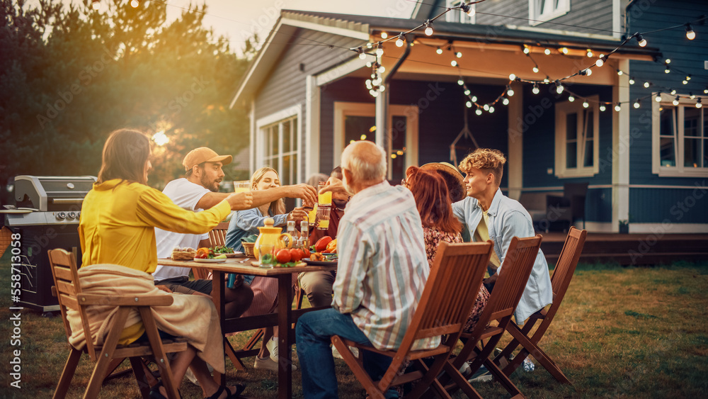 Family and Multiethnic Diverse Friends Gathering Together at a Garden Table Dinner. Old and Young Pe