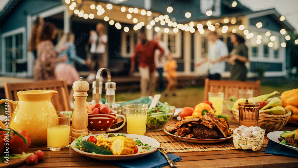 Backyard Dinner Table with Tasty Grilled Barbecue Meat, Fresh Vegetables and Salads. Happy Joyful Pe