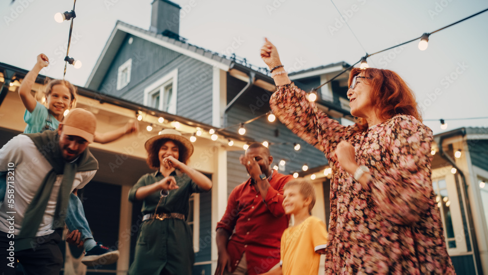 Diverse Multicultural Friends and Family Dancing Together at an Outdoors Garden Party Celebration. Y