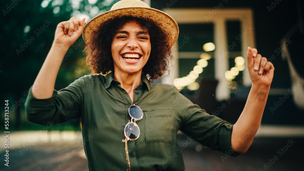 Portrait of a Beautiful Multiethnic Female Dancing and Having Fun on a Porch of a Residential Home. 