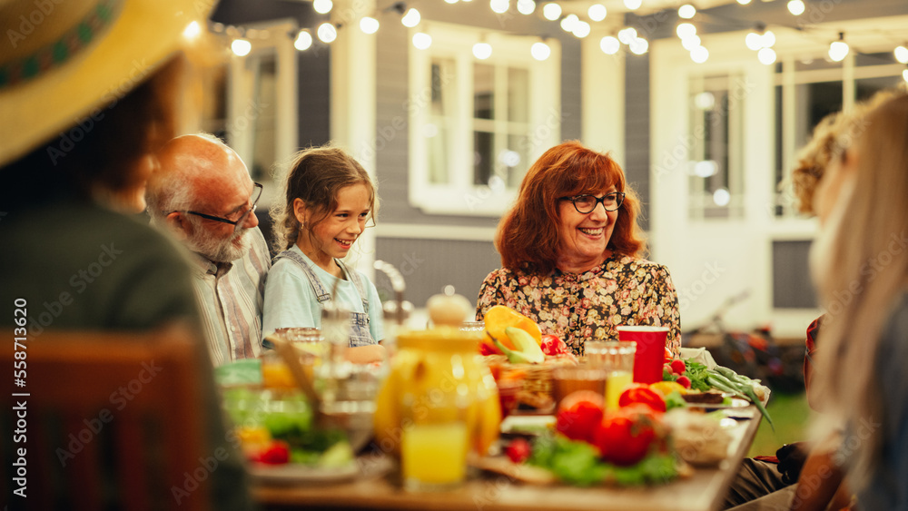 Grandmother Telling Funny Childhood Stories to Her Diverse Family and Multicultural Friends During a