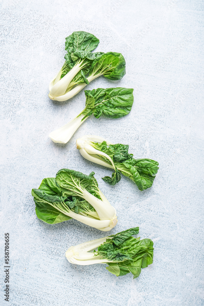 Fresh green pak choi cabbage on light background