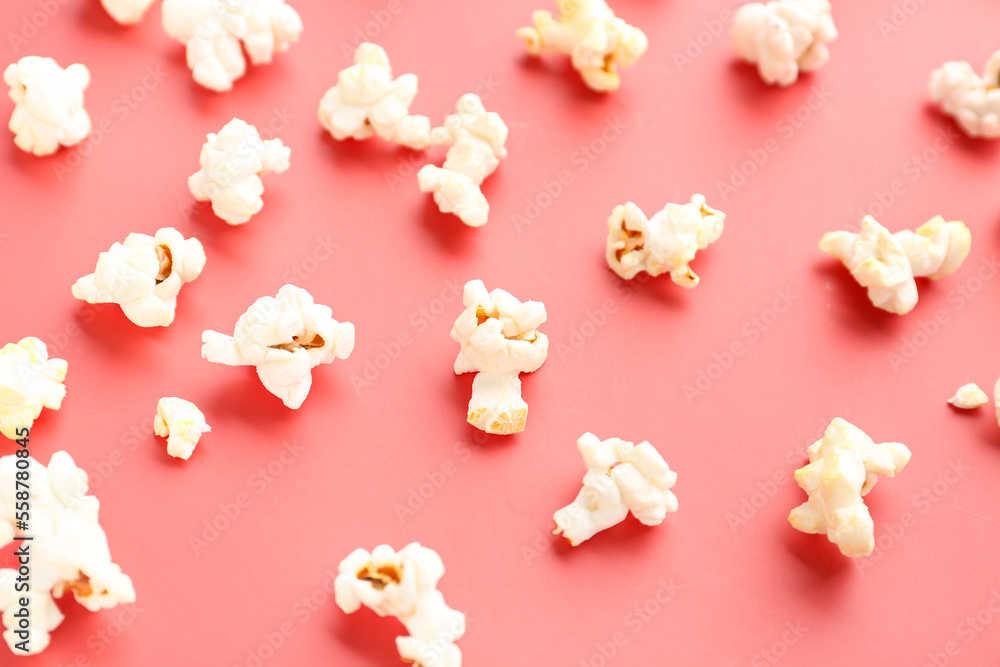 Tasty popcorn on red background