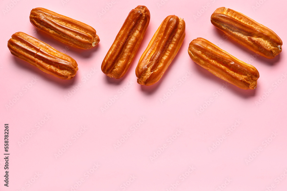 Sweet eclairs on pink background