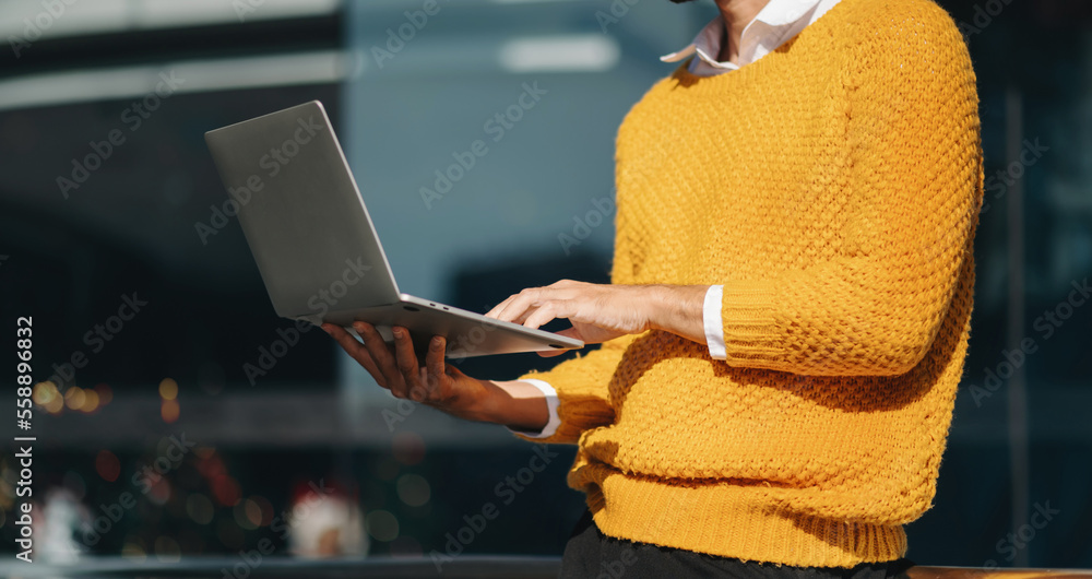 Businessman s hands typing on smartphone and  laptop keyboard in morning light computer, typing, onl