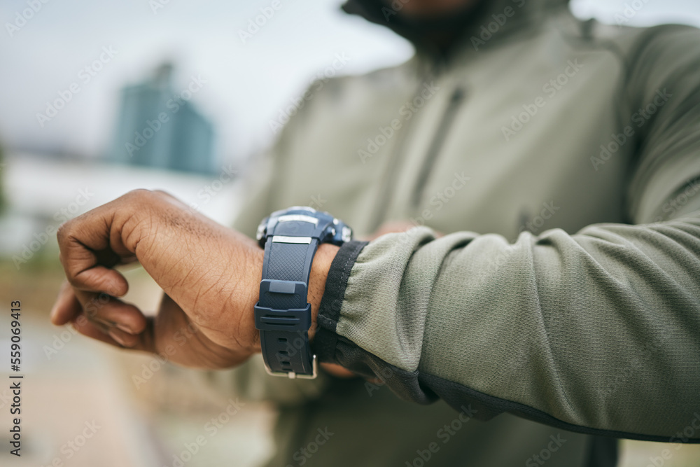 Fitness, training and hand of a man with a watch for progress, exercise monitor and tracking health 