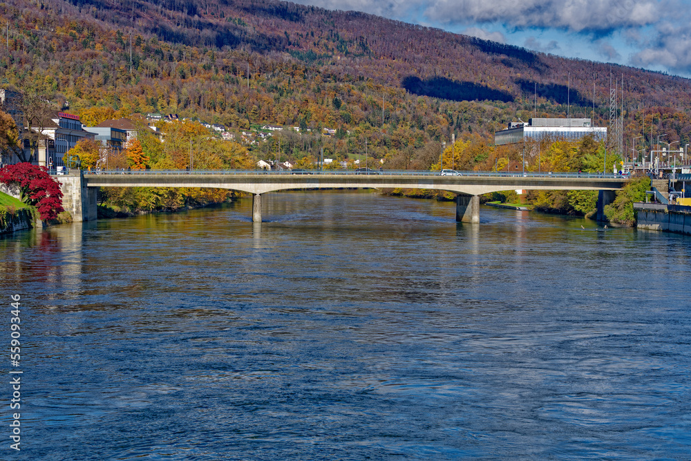 Beautiful autumn landscape with bridge over Aare River in the background at Swiss City of Olten on a