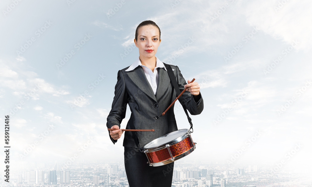 Young business woman with a drum