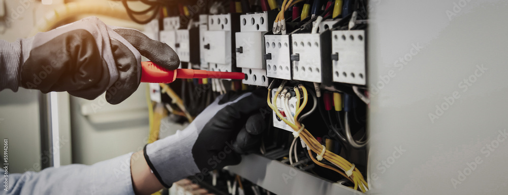 Electricity and electrical maintenance service, Engineer hand holding AC multimeter checking electri