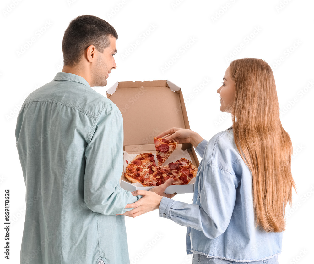 Happy young couple with fresh pizza on white background