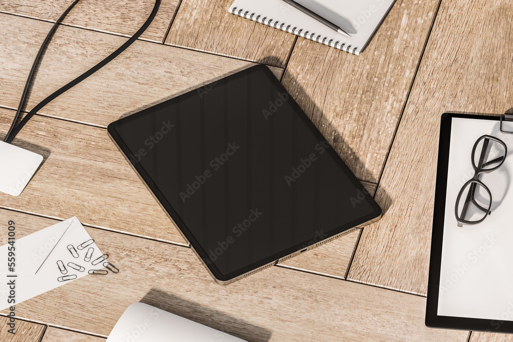 Perspective view on modern digital tablet with blank dark screen and space for your logo or text on 