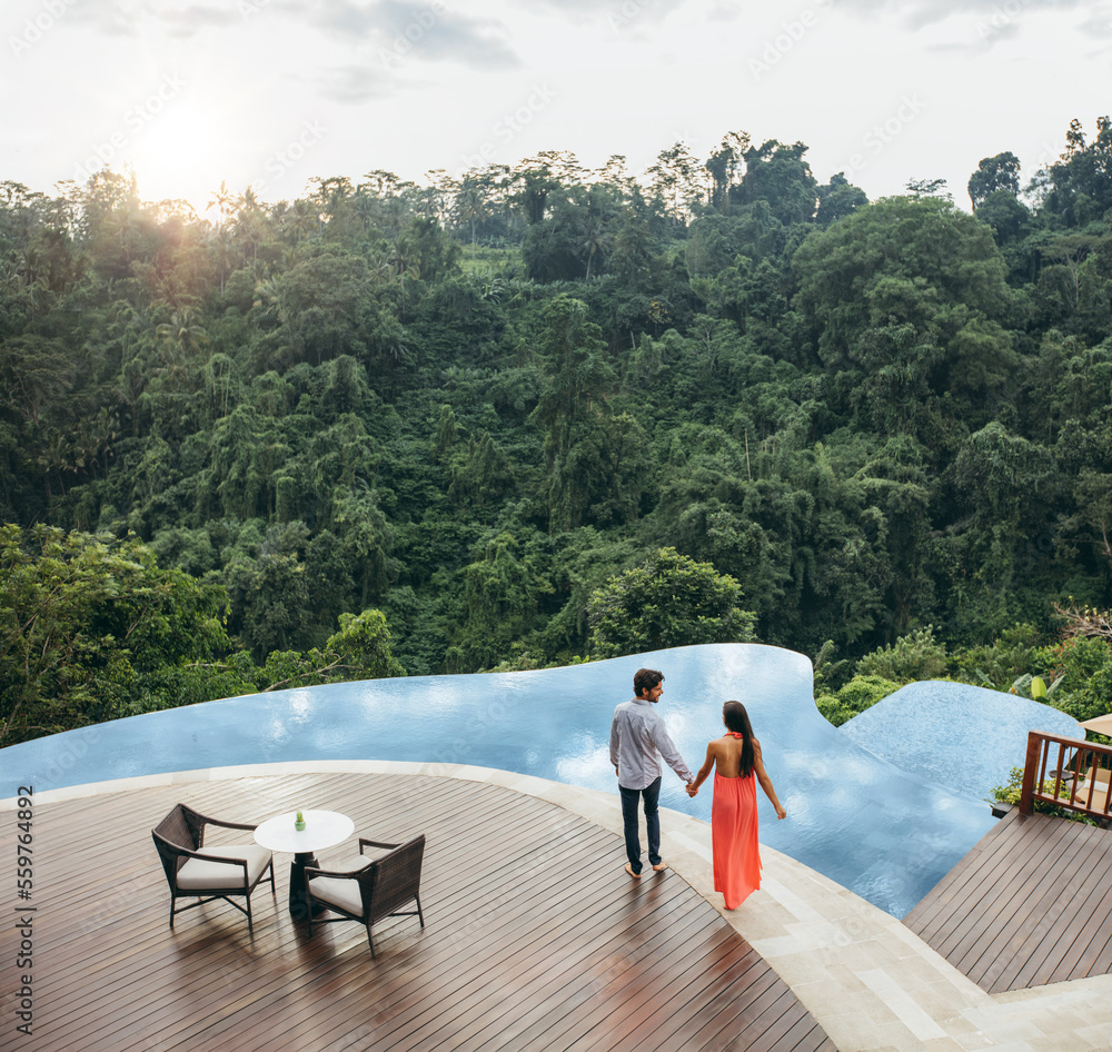 Couple in love near holiday resort poolside